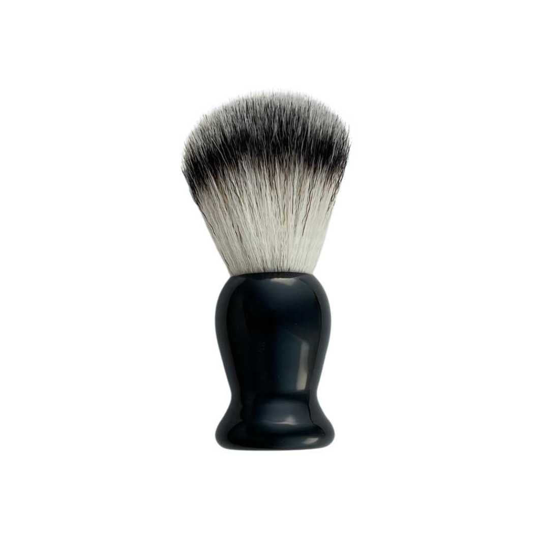 Black-handled shave brush with cream-and-black bristles