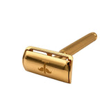 Gold Safety Razor V2 angled to show the head logo and grooved handle