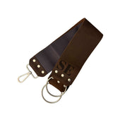 Dark brown razor strop with metal rings, hanging clip and S.E. logo